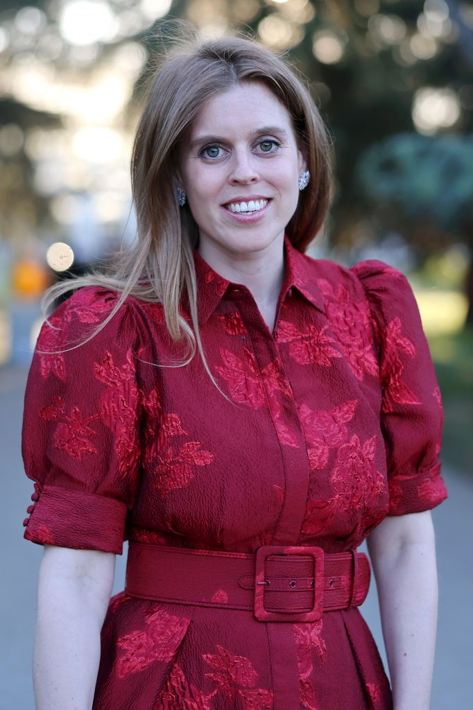Princess Beatrice smiling in red dress