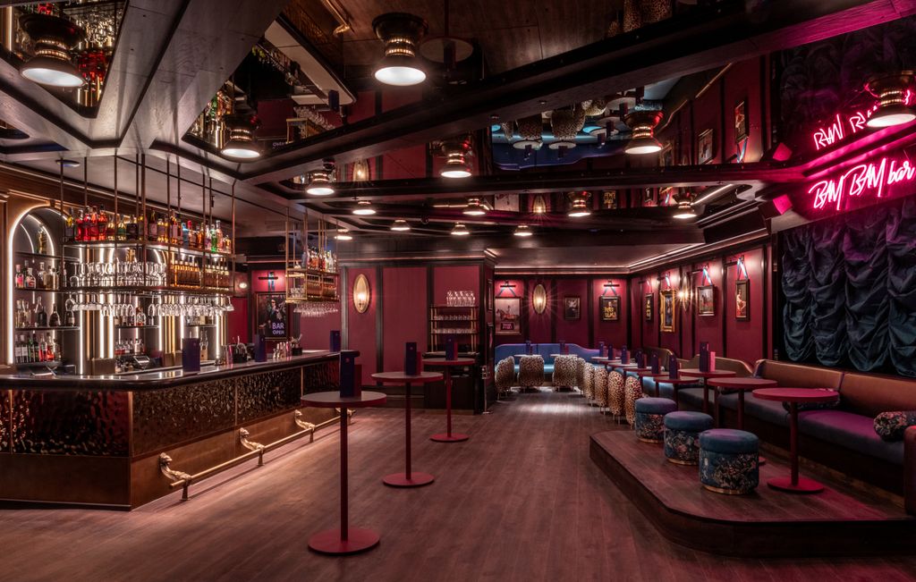 Dimly lit bar with a karaoke stage