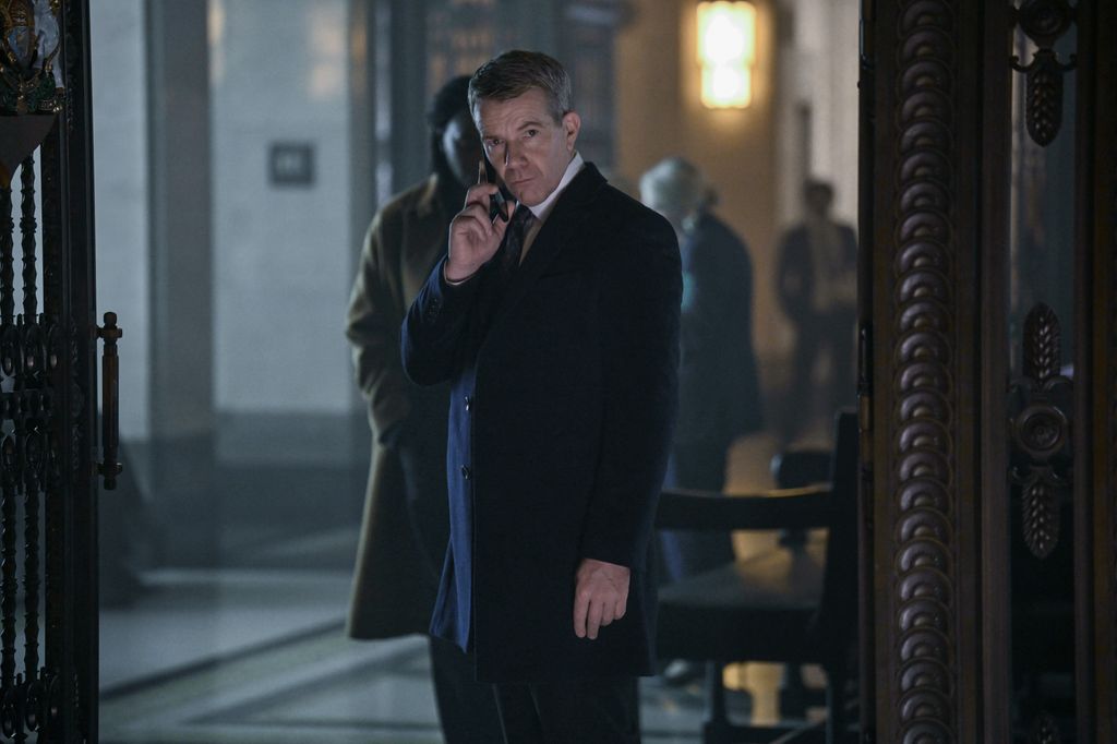 man in suit on the phone