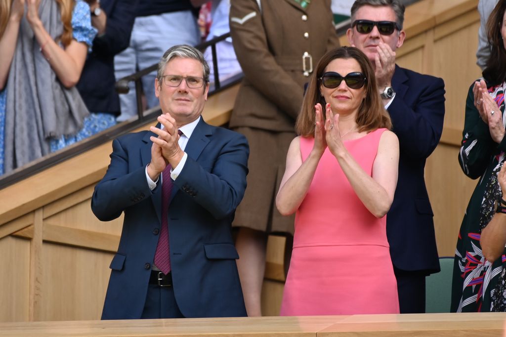 Leader of the Labour Party, Sir Keir Starmer stands alongside his wife, Lady Victoria Starmer, in the Royal Box on Centre Court during day eleven of The Championships Wimbledon 