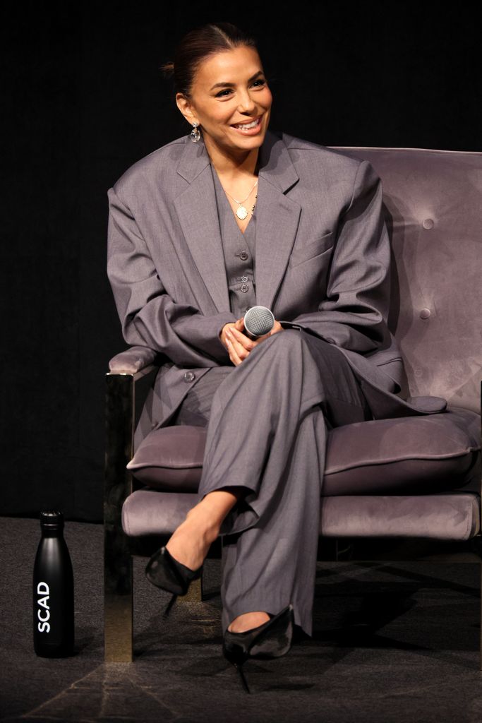 Eva Longoria in a grey suit