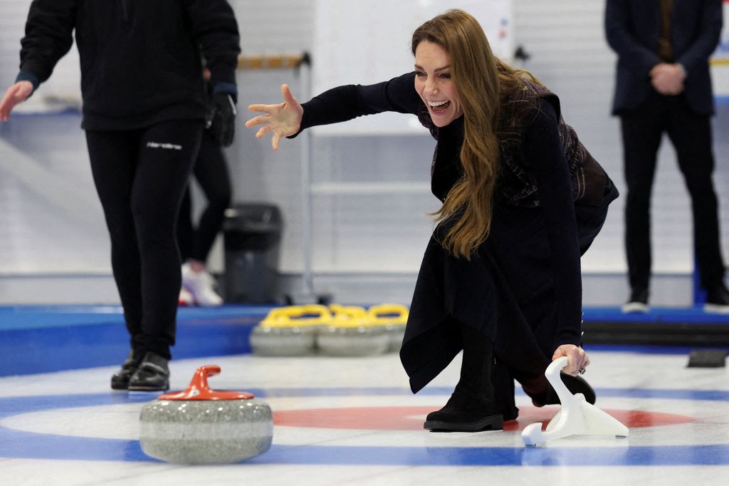 Kate giggling while curling