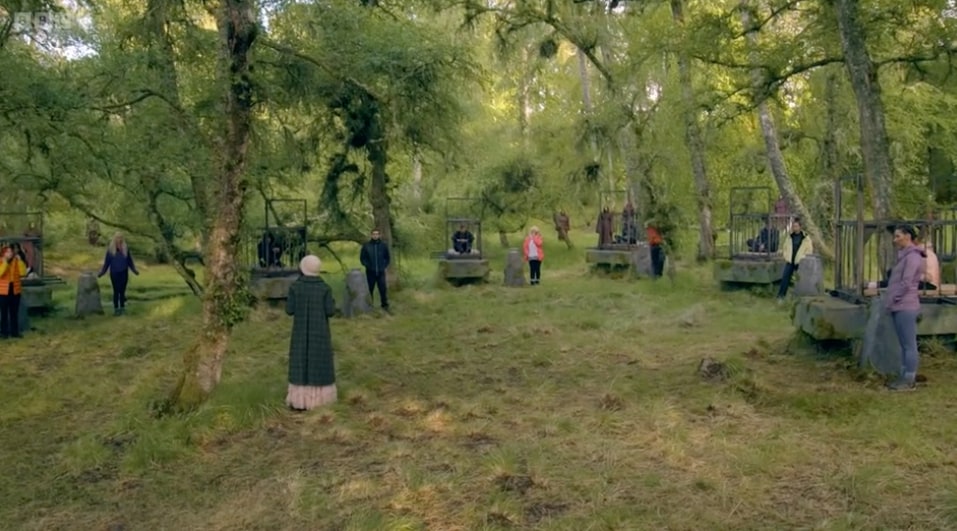 The Traitors contestants in cages during a challenge