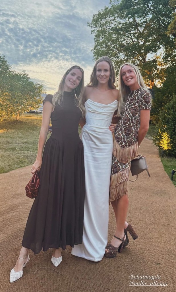 hum fleming in her bridal gown with two wedding guests