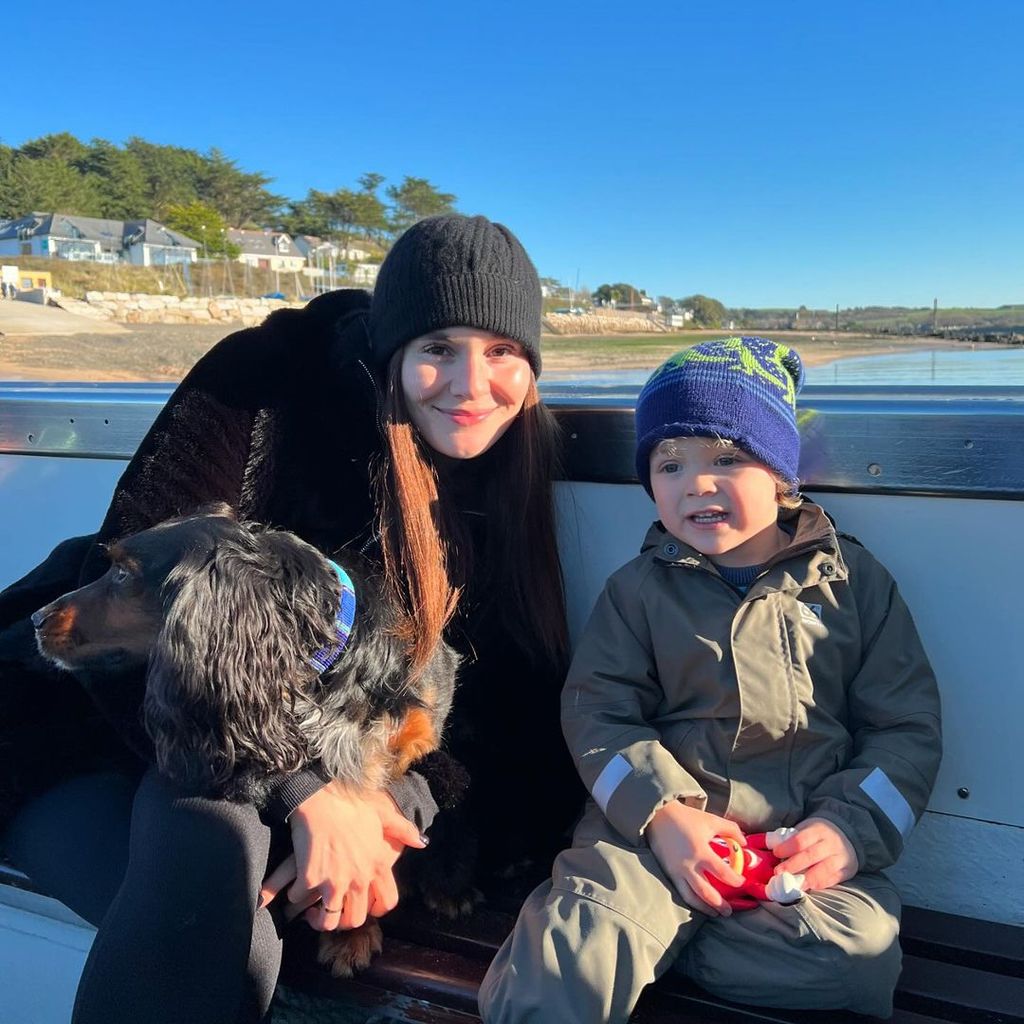 Holly Ramsay sitting down in a boat with George Peaty