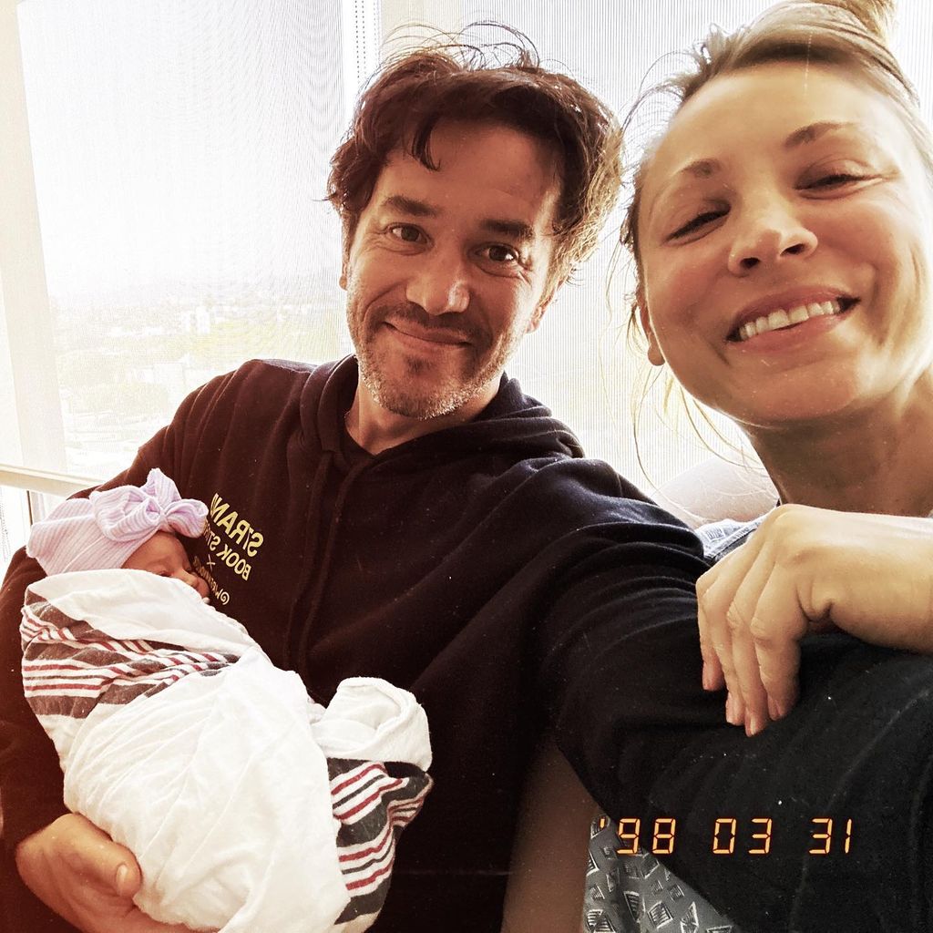 Tom Pelphrey and Kaley Cuoco with baby in swaddle