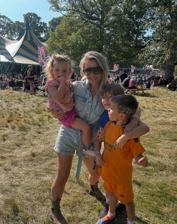 Helen Skelton in a denim outfit with her three children