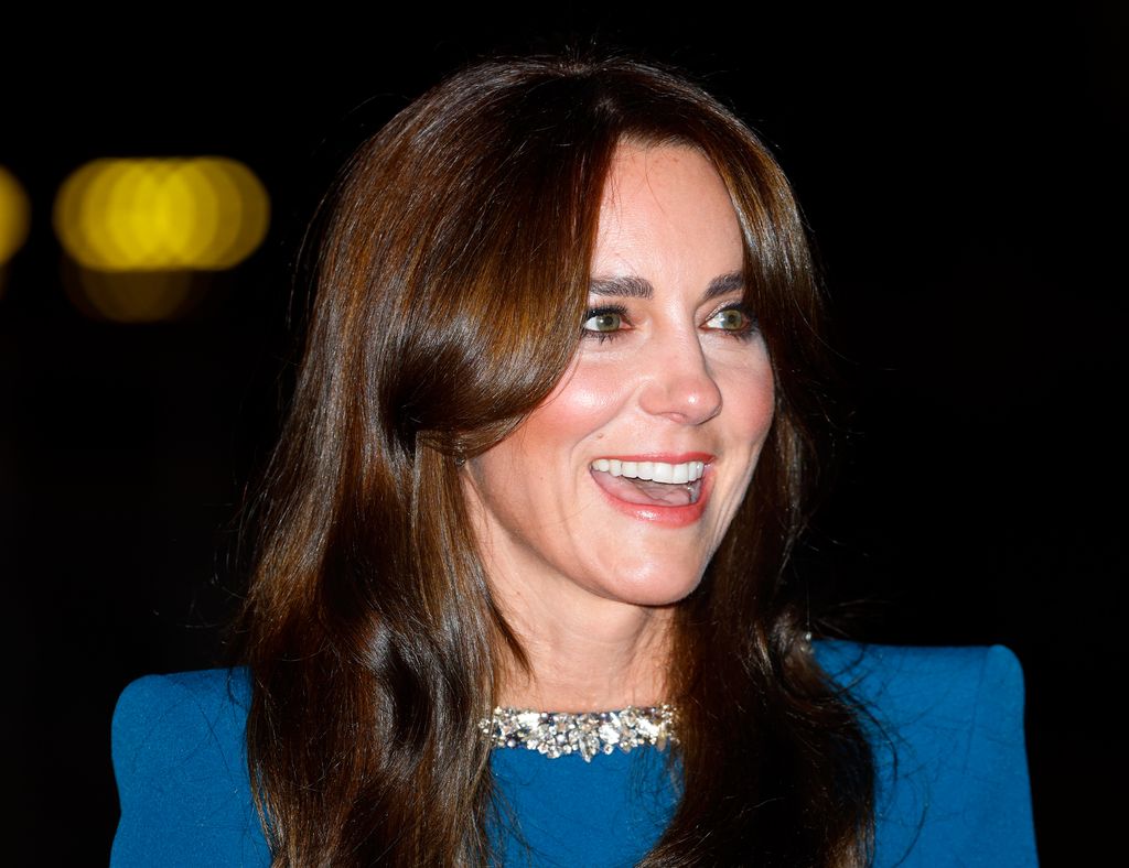  Catherine, Princess of Wales attends the Royal Variety Performance 2023 smiling and wearing a blue dress