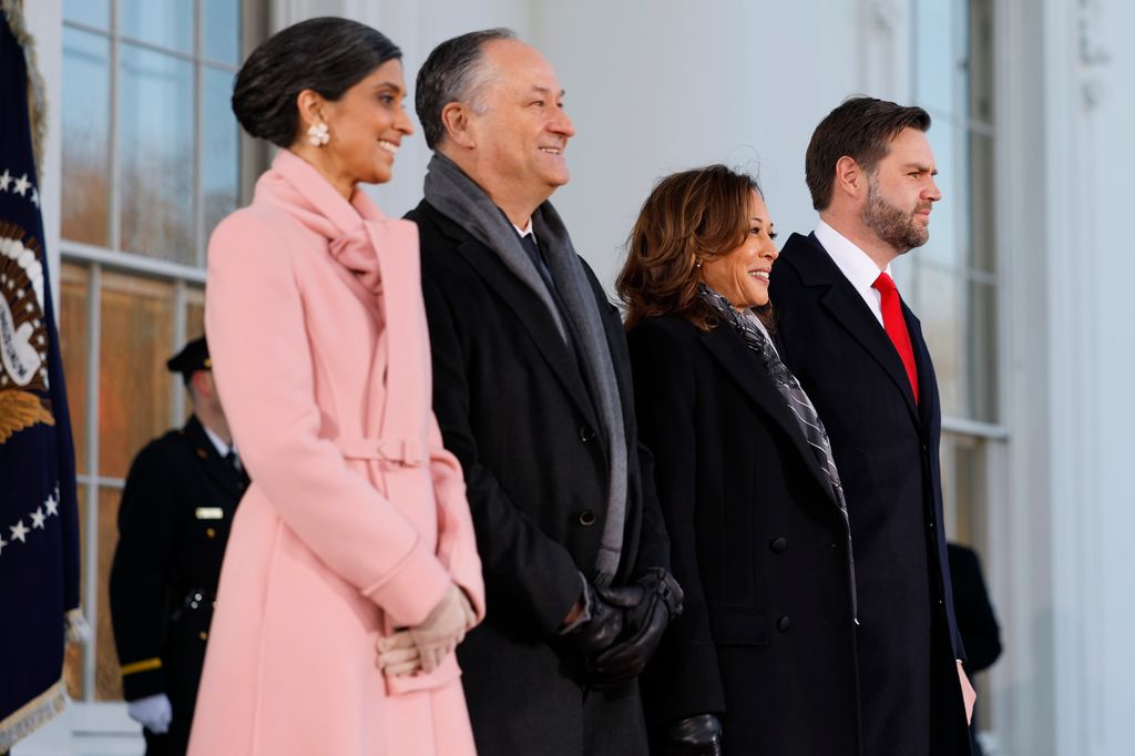 Usha Vance, second gentleman Doug Emhoff, U.S. Vice President Kamala Harris, and U.S. Vice President-elect former Sen. J.D. Vance posed together outside the White House ahead of the inauguration. 

Usha donned a pink coat dress with a pair of diamond-encrusted floral earrings. while Kamala opted for a black coat striped scarf.