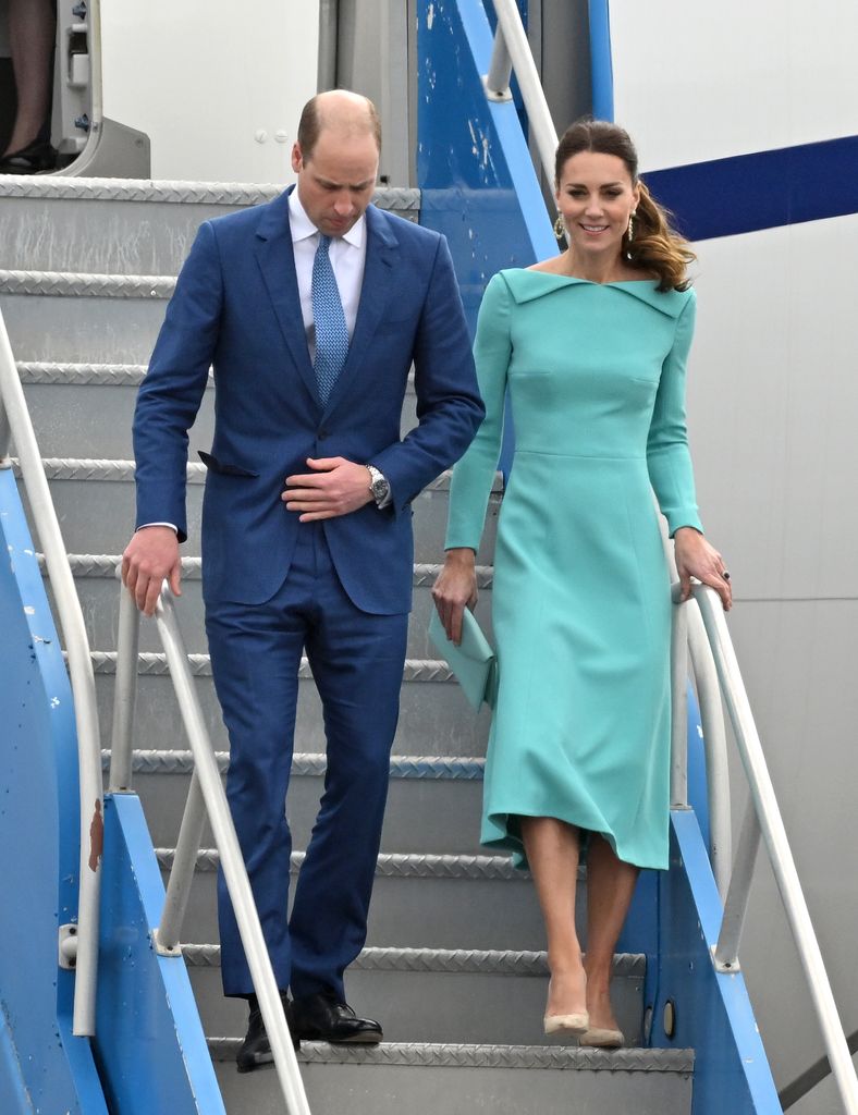 Prince William and Kate Middleton walk down plane steps