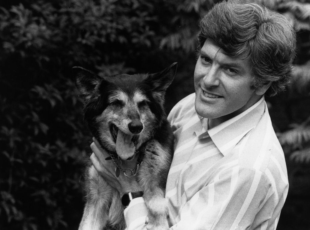 29th May 1977:  Peter Purves holds 'Petra', the beloved dog in the 'Blue Peter' TV programme, who retires from show-business after 15 years,  555 television hours and 1192 appearances on the programme. Peter Purves has cared for Petra since he came to the programme in 1968.  (Photo by Central Press/Getty Images)