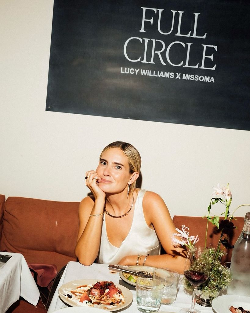 Lucy Williams at table during party