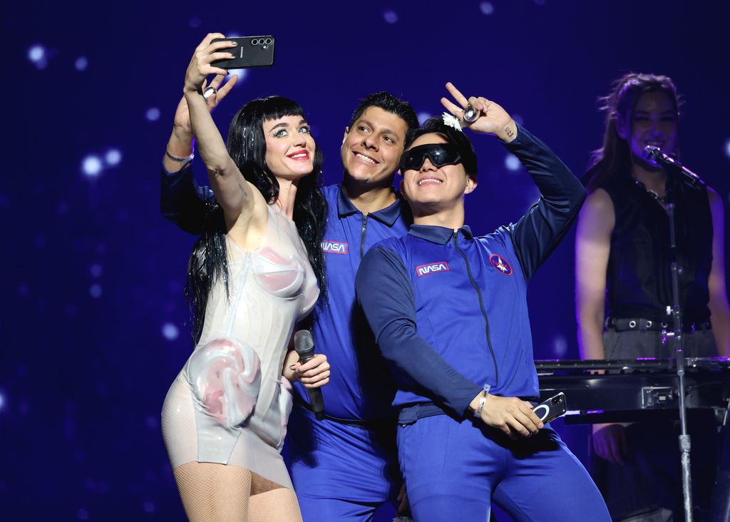 Katy Perry takes a selfie with fans onstage during the Katy Perry The Lifetimes Tour 2025 at CDMX Arena on April 23, 2025 in Mexico City, Mexico