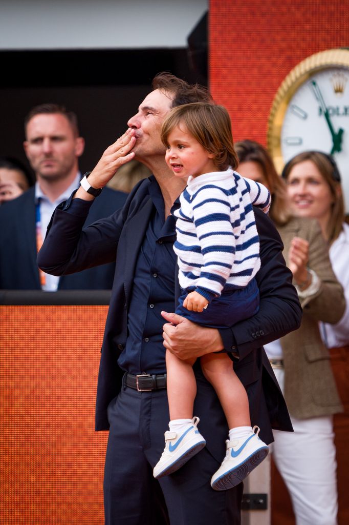  Rafael Nadal and son Rafael Nadal Junior acknowled the crowd as they leave Court Philippe-Chatrier