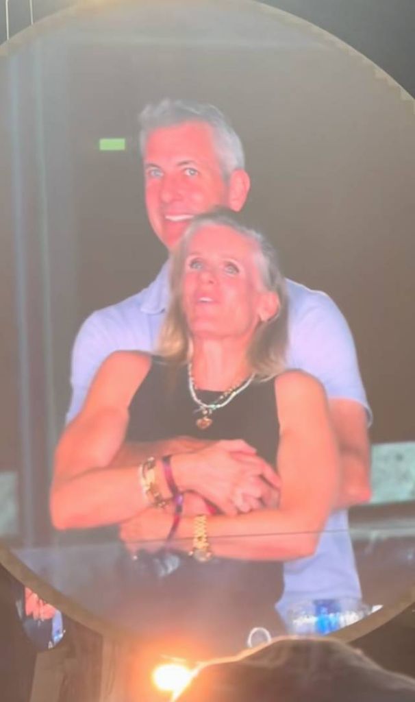 Andy hugging woman at coldplay gig