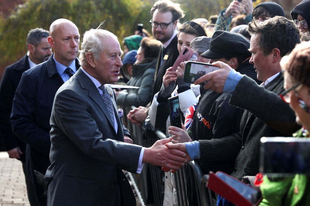 The King greets well-wishers as he arrives at Lichfield Cathedral