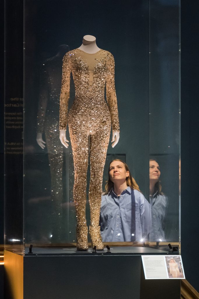 A sequined catsuit designed by Zuhair Murad and a pair of Stuart Weitzman boots worn on the 1989 tour at the V&A