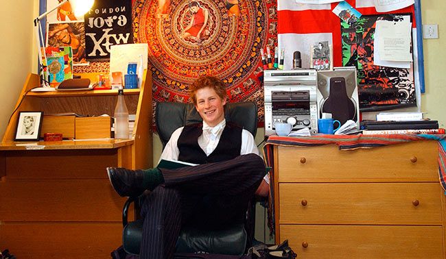 Prince Harry sitting in Eton bedroom
