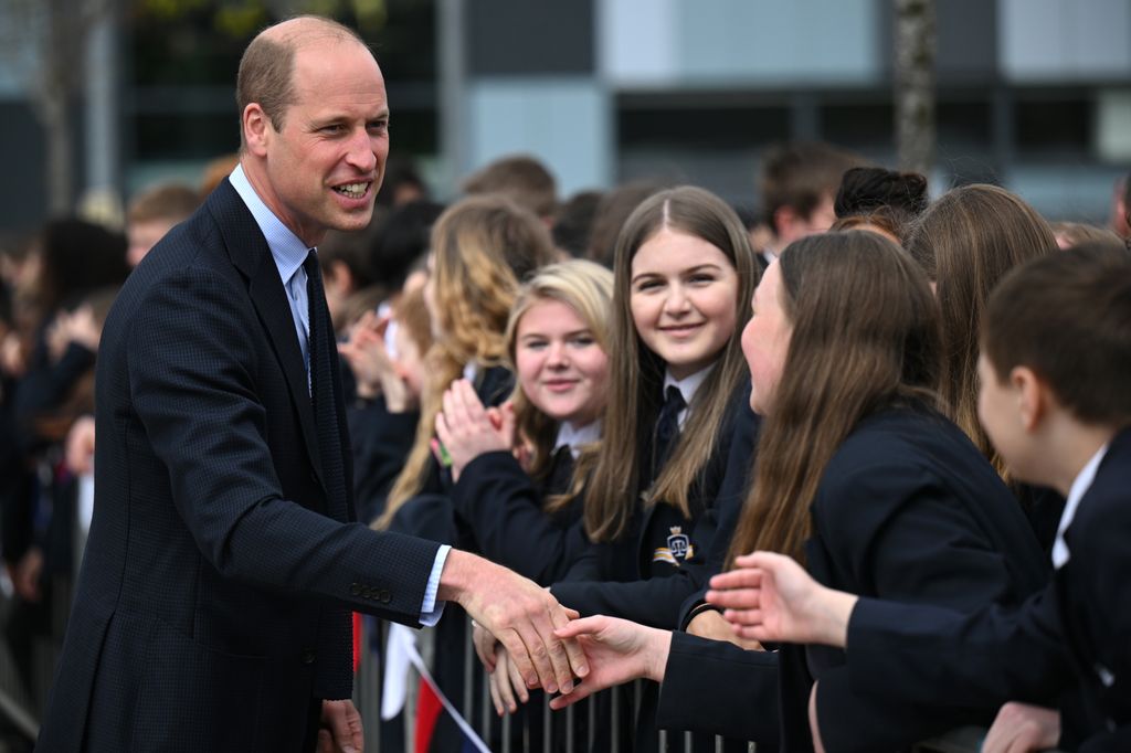 Prince William speaking to pupils outside school in Midlands