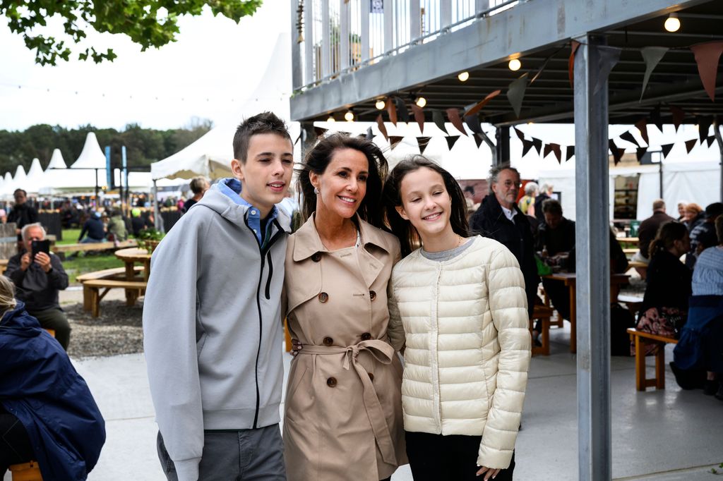 Princess Marie of Denmark (C) poses with her children Countess Athena (R) and Count Henrik during a visit to the Tonder Festival 