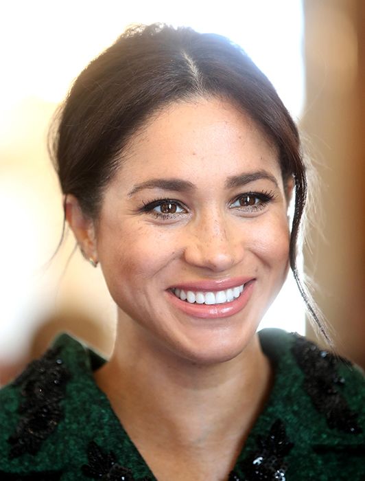 meghan markle close up photo in green coat