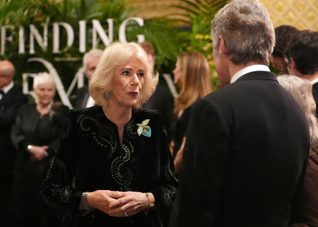 WINDSOR, ENGLAND - JANUARY 28: Queen Camilla speaks to guests in the Grand Reception Room after they attended the premiere of Prime Video's Finding Harmony: A King's Vision, at Windsor Castle on January 28, 2026 in Windsor, England. The documentary outlines Charles' philosophy of harmony, which encourages people to see themselves as part of nature, not apart from nature, and will be available on Prime Video from Friday February 6. (Photo by Jonathan Brady - Pool/Getty Images)