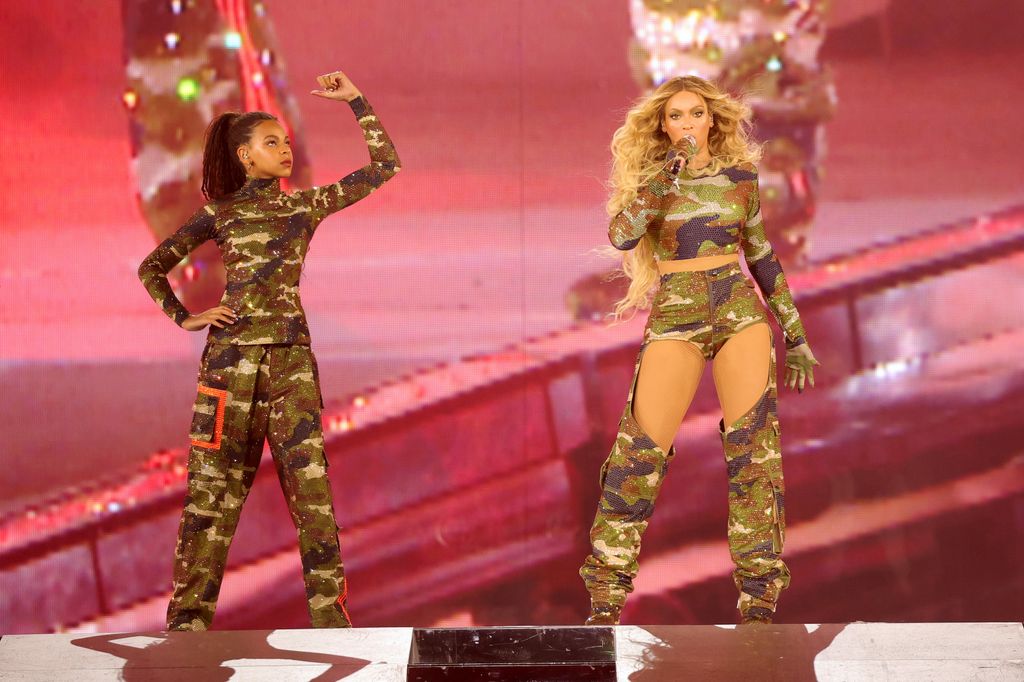 ATLANTA, GEORGIA - AUGUST 11: (EDITORIAL USE ONLY) (EXCLUSIVE COVERAGE) (L-R) Blue Ive Carter and BeyoncÃ© perform onstage during the "RENAISSANCE WORLD TOUR" at Mercedes-Benz Stadium on August 11, 2023 in Atlanta, Georgia. (Photo by Kevin Mazur/WireImage for Parkwood)