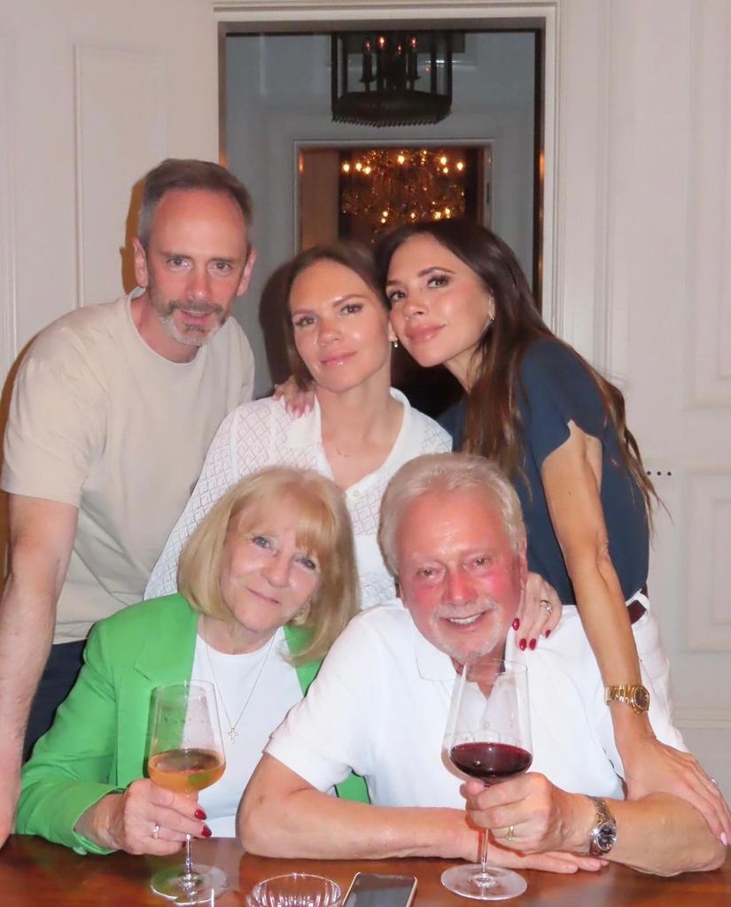 Victoria Beckham posing with her sister Louise, brother and parents