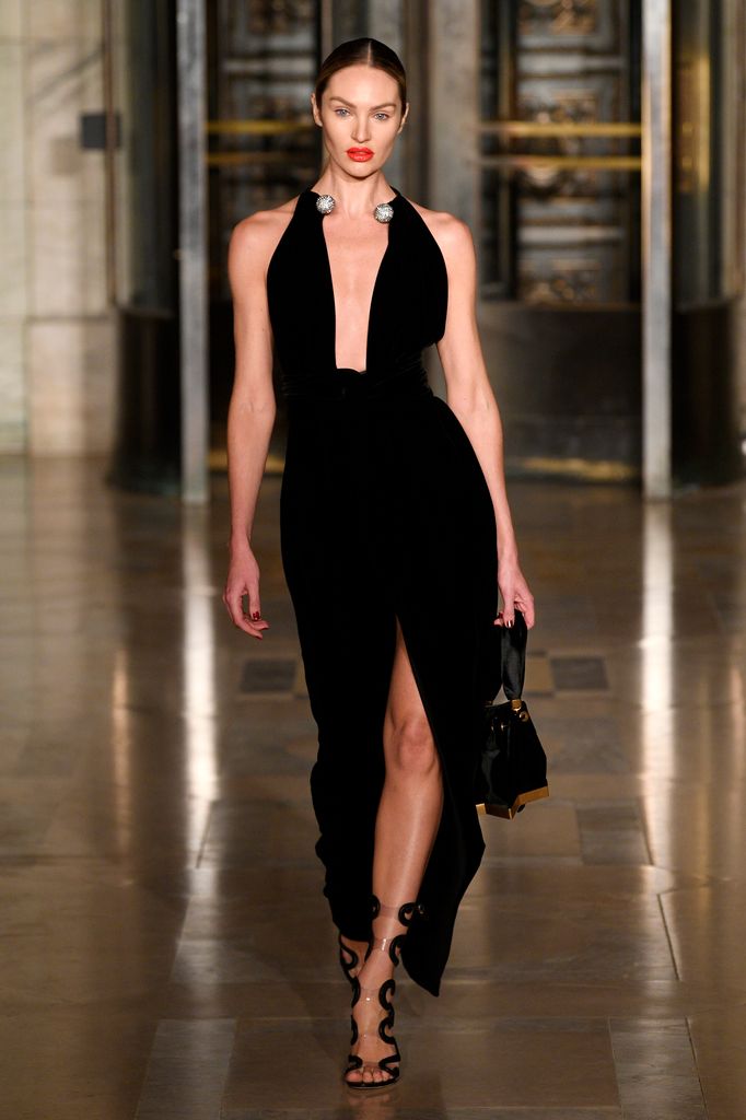 Candice Swanepoel in black dress on the catwalk