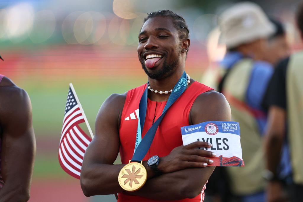 Noah Lyles poses with the flag and the gold medal after winning the men's 100 meter final on Day Three 2024 U.S. Olympic Team Trials Track & Field at Hayward Field on June 23, 2024 in Eugene, Oregon