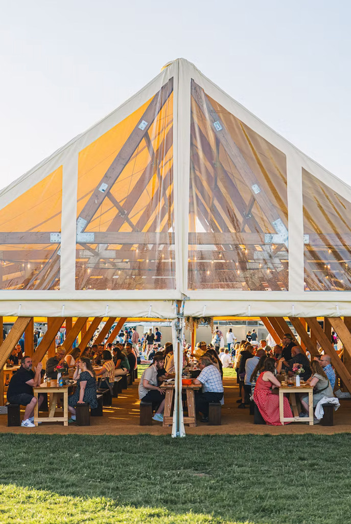 large venue tent with people in it 