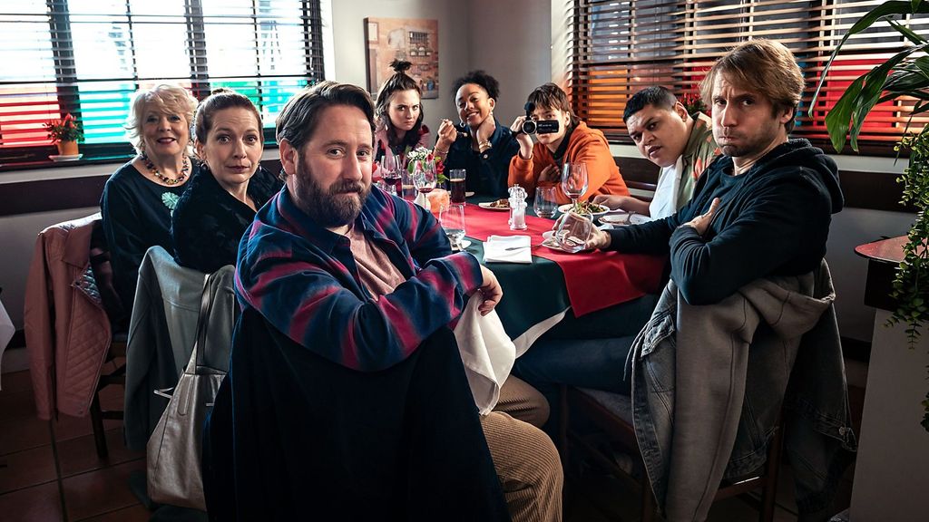group of people sitting at restaurant table