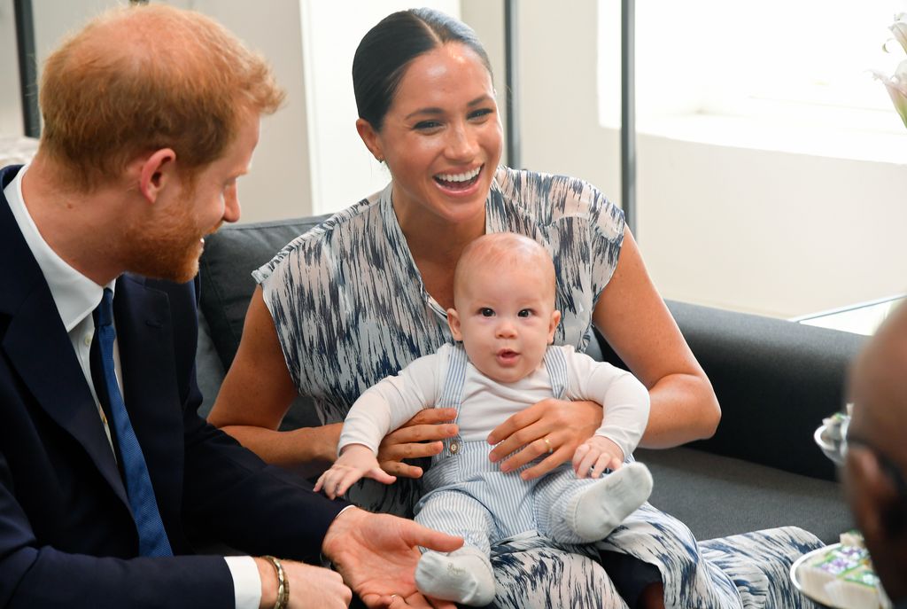 Meghan laughing with Archie