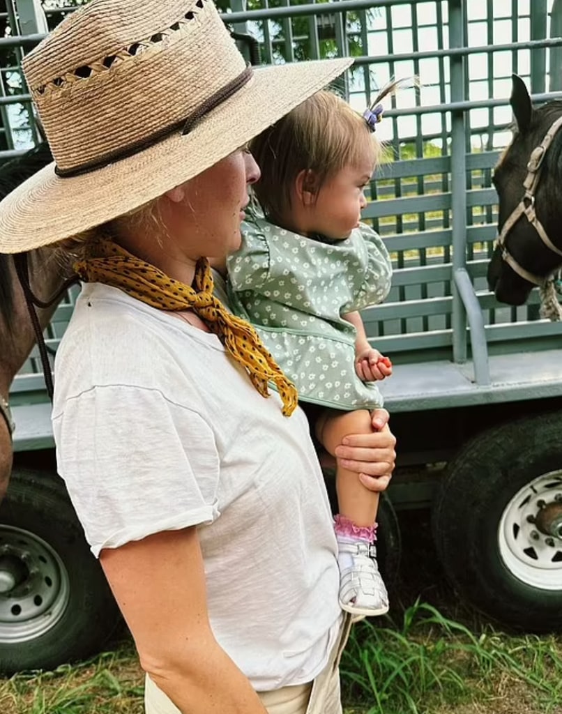 Rumer cuddles her adorable toddler