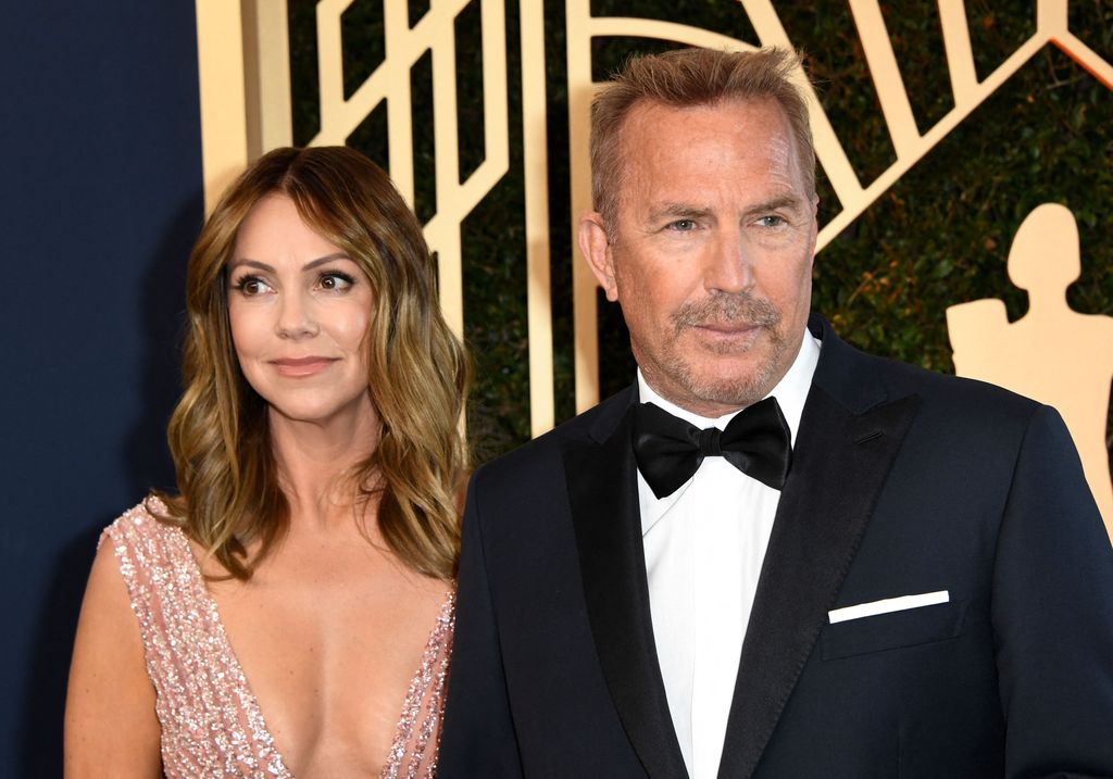 Kevin Costner and Christine Baumgartner arrive for the 28th Annual Screen Actors Guild (SAG) Awards in California on February 27, 2022