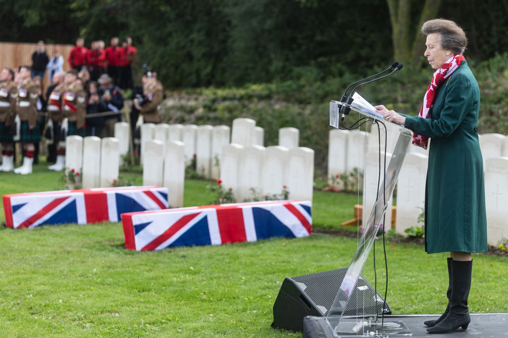 Britain's Princess Anne, Princess Royal reads a blessing as she attends the funeral of two unidentified Scottish soldiers who died during World War I, as they are buried at the Loos British Cemetery of the Commonwealth War Graves Commission (CWGC), in Loos-en-Gohelle, near Lens, northern France, on Septmber 26, 2024. Gun salutes rang out as two Scottish soldiers killed in World War I were reburied in northern France where Britain's Princess Anne opened an extended cemetery for the dead from the 1914-18 conflict still being found over a century on. The two unidentified men were buried among the perfectly aligned gravestones at Loos-en-Gohelle alongside 46 other unknown soldiers identified by the Commonwealth War Graves Commission (CWGC). (Photo by Sameer Al-DOUMY / AFP) (Photo by SAMEER AL-DOUMY/AFP via Getty Images)