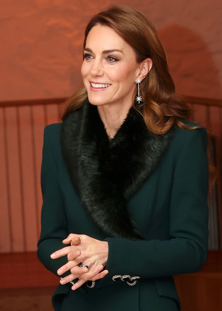 Catherine, Princess of Wales side on in green coat 