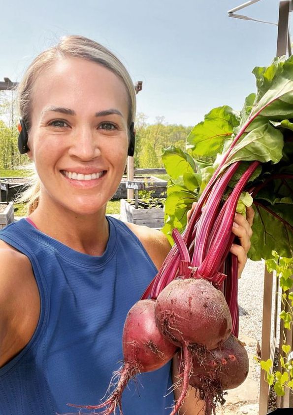 Carrie Underwood holding radishes