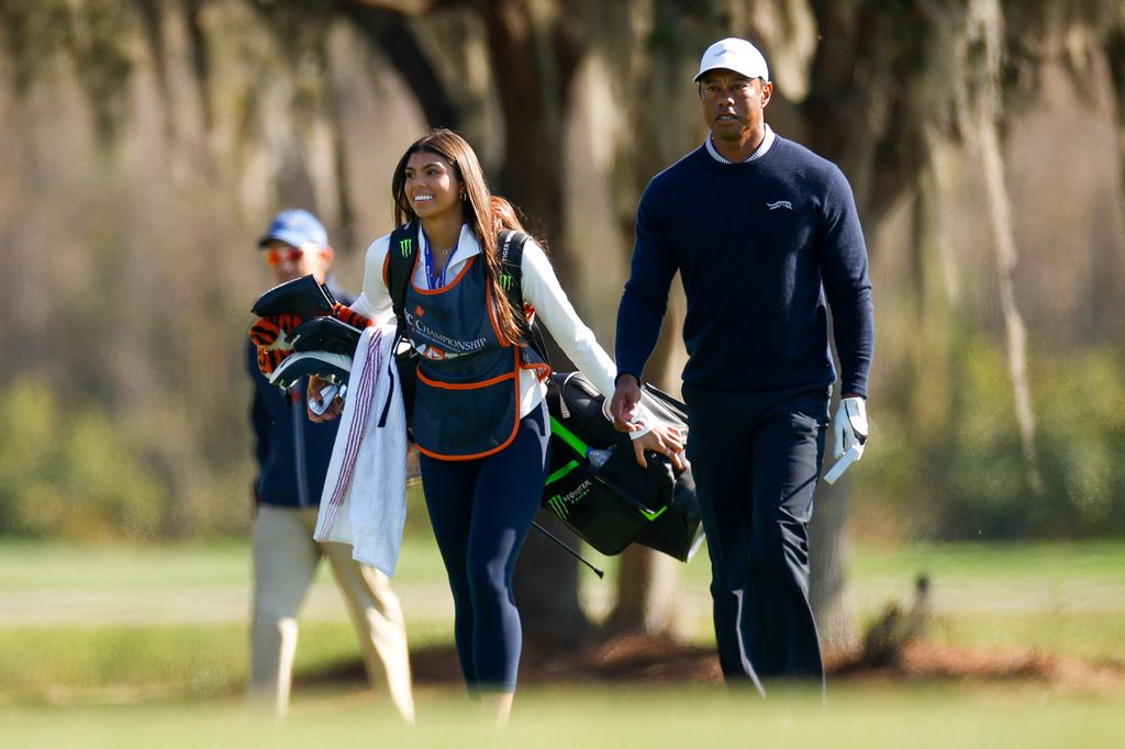 Tiger Woods and his daughter Sam Woods walk the 11th hole during the first round of the PNC Championship at Ritz-Carlton Golf Club on December 21, 2024 in Orlando, Florida