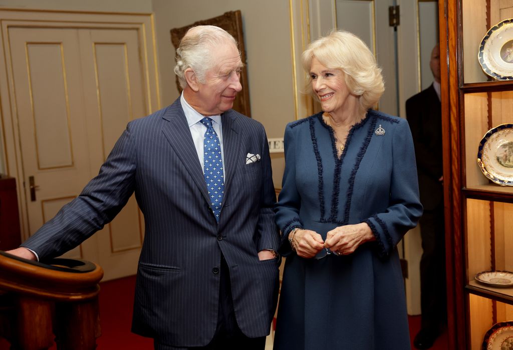 LONDON, ENGLAND - FEBRUARY 23: King Charles III and Camilla, Queen Consort laugh during a reception to celebrate the second anniversary of The Reading Room at Clarence House on February 23, 2023 in London, England. The Reading Room, which was official launched by the Queen Consort 2 years ago, champions literacy and encourages readers to find new literature. (Photo by Chris Jackson/Getty Images)
