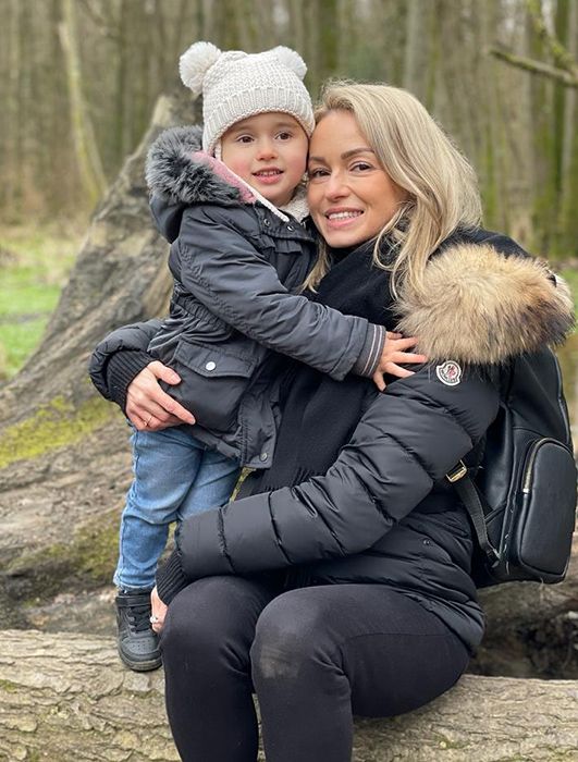Ella with mum Ola smiling in forest