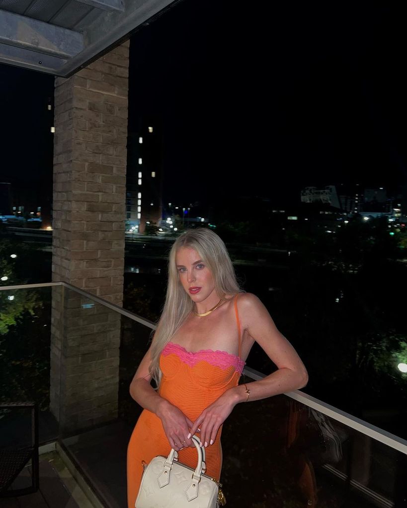 Keely Hodgkinson wears an orange dress