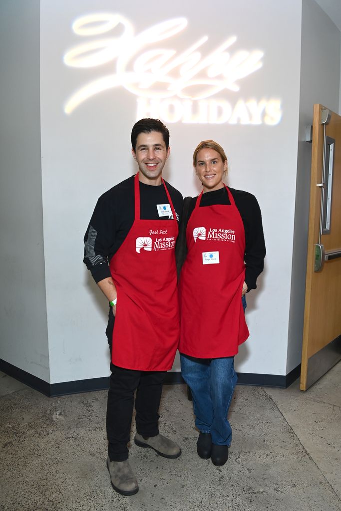 Josh Peck and Paige Peck volunteer at the Los Angeles Mission's 87th Annual Christmas Celebration at Los Angeles Mission on December 22, 2023 in Los Angeles, California