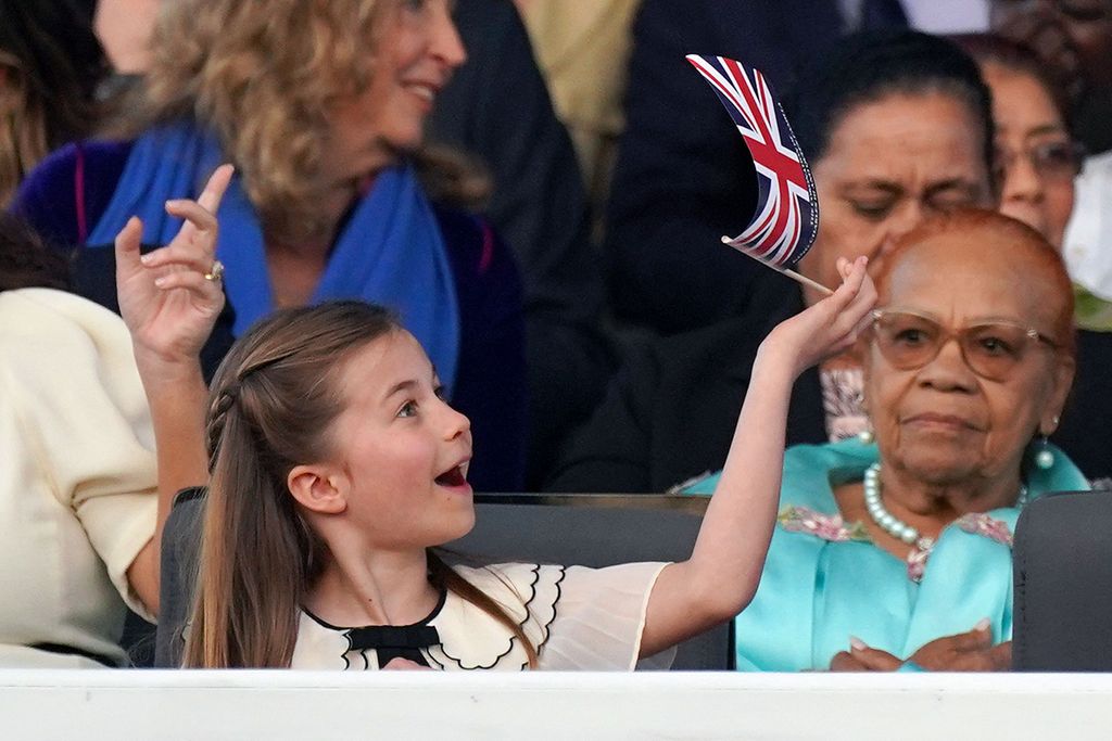 Princess Charlotte got into the party spirit while waving a flag