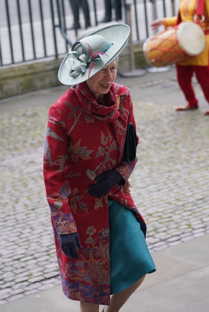 Princess Anne wearing red coat and teal dress