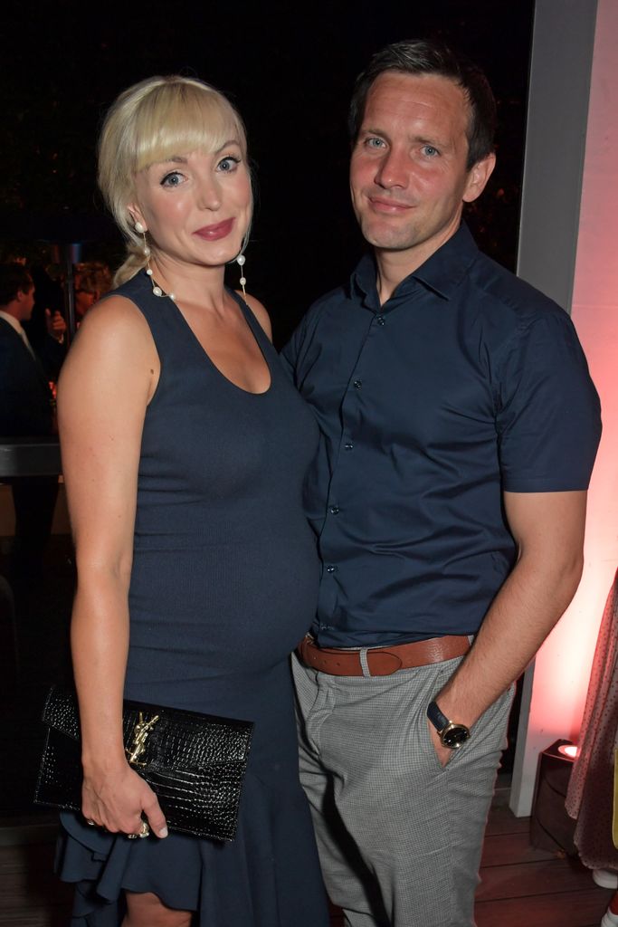 Pregnant Helen George posing for a photo with Jack 