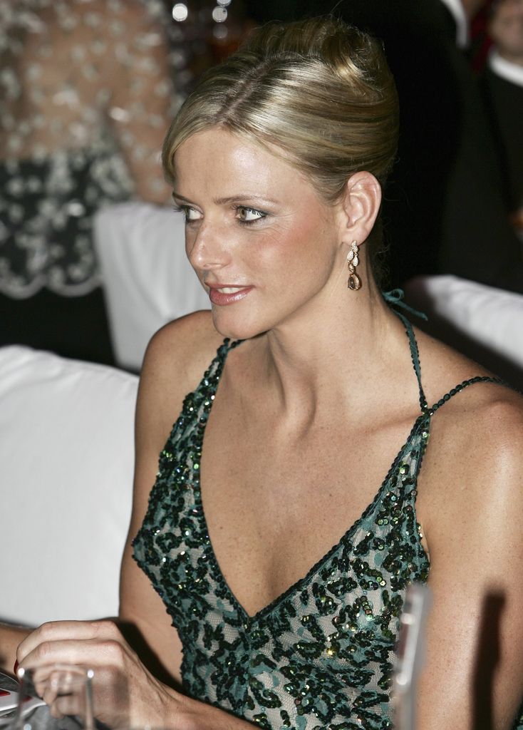 woman in green sequin dress at ball dinner 