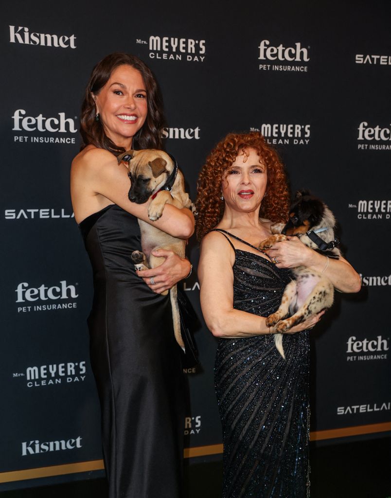 sutton foster bernadette peters holding puppies