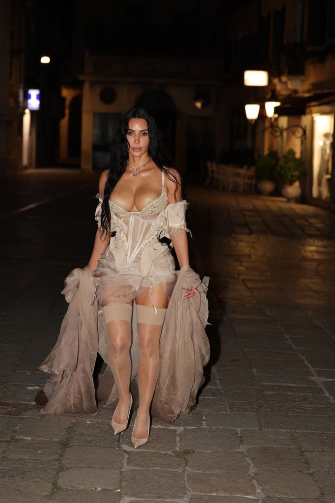 Kim Kardashian slipped into a sultry vintage-inspired look as she posed on her way to a late-night pajama party after-party