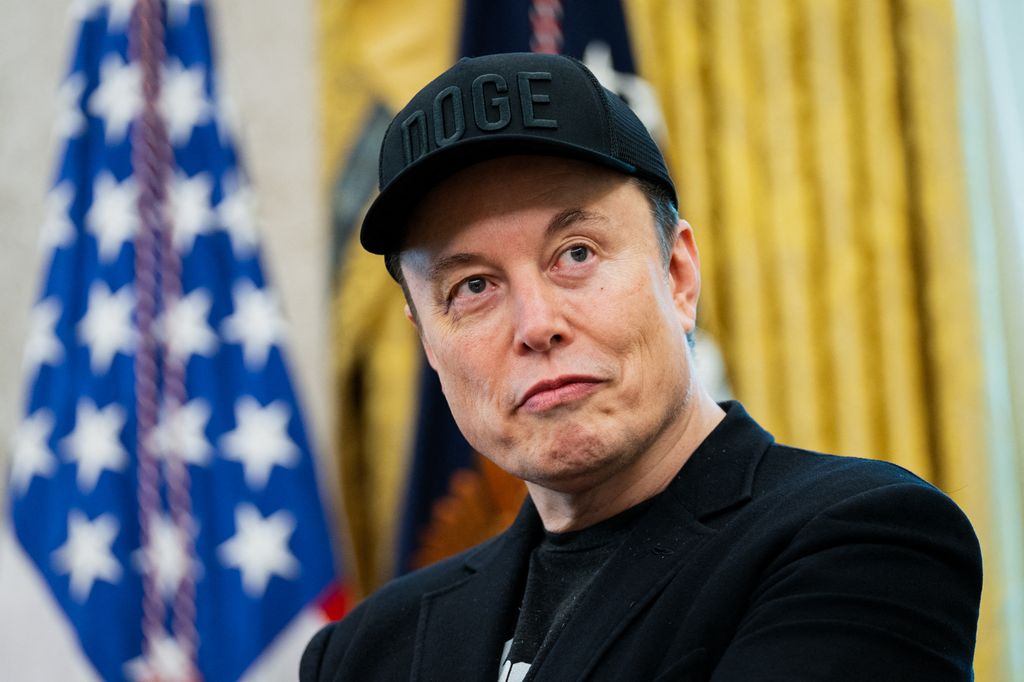 Elon Musk looks on during a news conference with US President Donald Trump in the Oval Office of the White House in Washington, DC, on May 30, 2025. Musk, who stormed into US politics as President Trump's chainsaw-brandishing sidekick, announced on May 28 that he is leaving his role in US government, intended to reduce federal spending, shortly after his first major break with the President over Trump's signature spending bill.